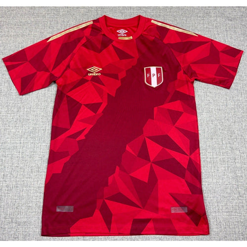 Second Half Supply Co, LLC 2018 Peru FPF World Cup third jersey in red with geometric pattern and gold shoulder tape.