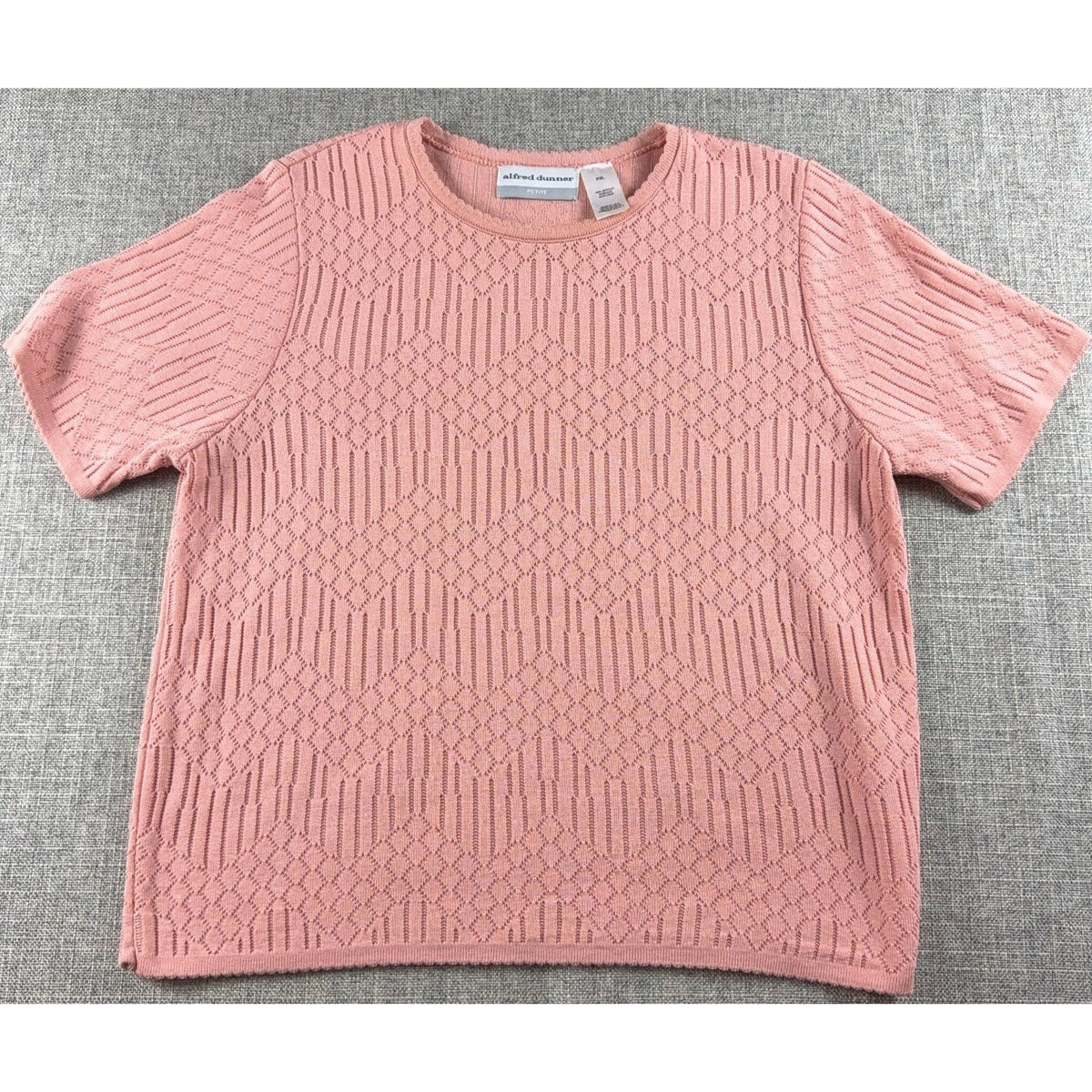Second Half Supply Co, LLC vintage pink pointelle knit short sleeve sweater with geometric pattern and crew neck.