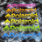 Second Half Supply Co, LLC black and gray tie-dye cropped shirt with repeating rainbow Polaroid logo graphic