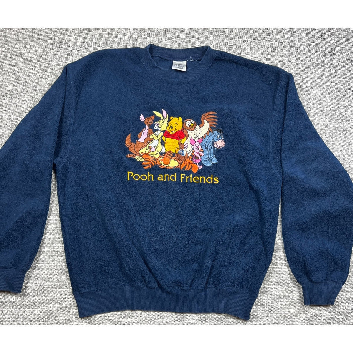 Second Half Supply Co, LLC vintage navy fleece sweatshirt with embroidered Winnie the Pooh and Friends graphic