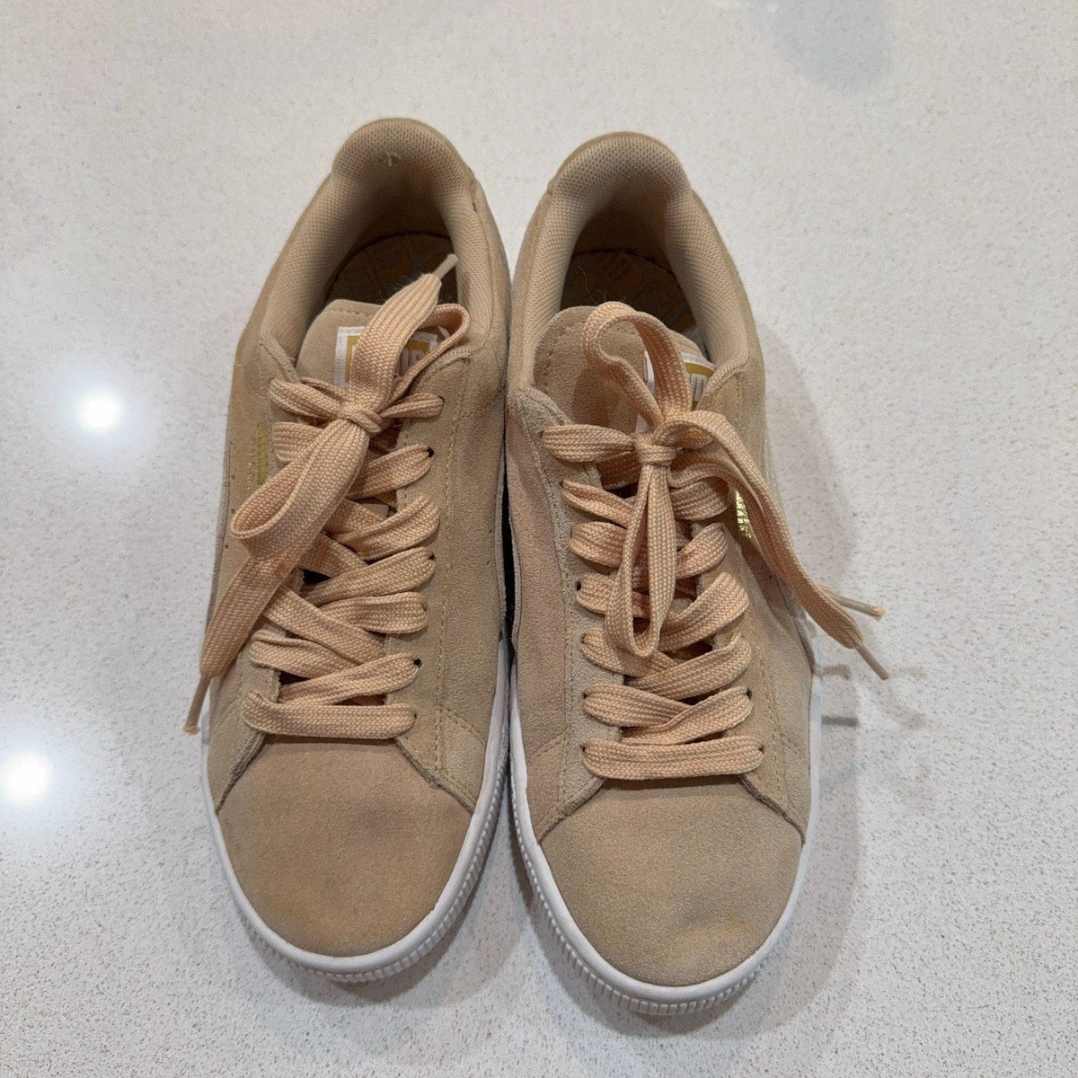Second Half Supply Co, LLC Puma Suede Classic women's sneakers in beige and peach with lace-up closure and rubber soles.