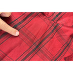 Second Half Supply Co, LLC red and black plaid silk shirt fabric showing a small snag detail