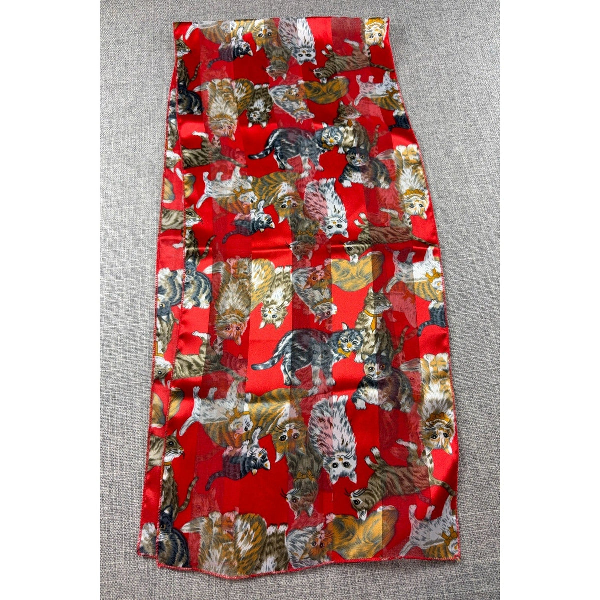Second Half Supply Co, LLC red rectangular scarf with whimsical cat print and alternating sheer and satin panels