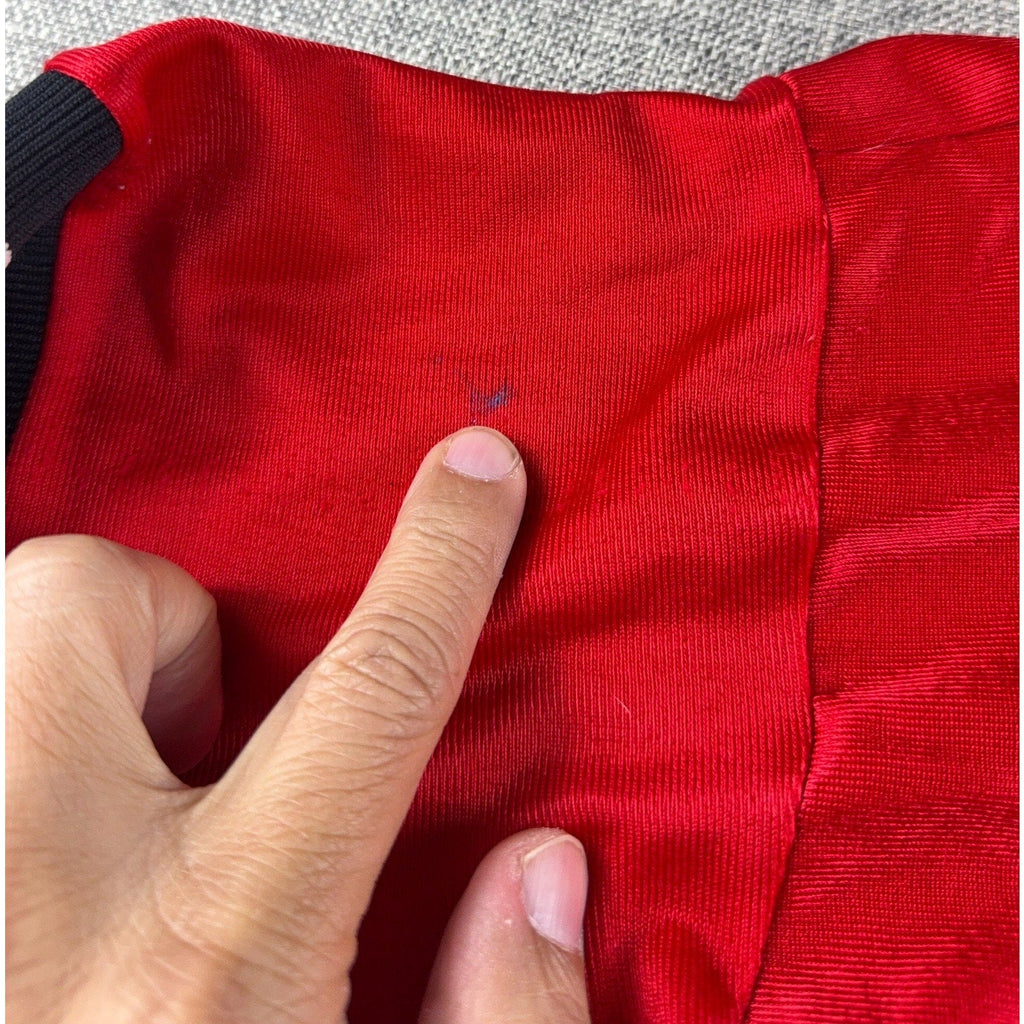 Second Half Supply Co, LLC vintage red satin varsity jacket showing a small spot mark on the fabric
