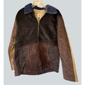 Second Half Supply Co, LLC reworked Carhartt patchwork jacket in brown corduroy with a contrasting blue collar.