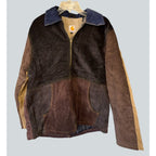 Second Half Supply Co, LLC reworked Carhartt patchwork jacket in brown corduroy with a contrasting blue collar.