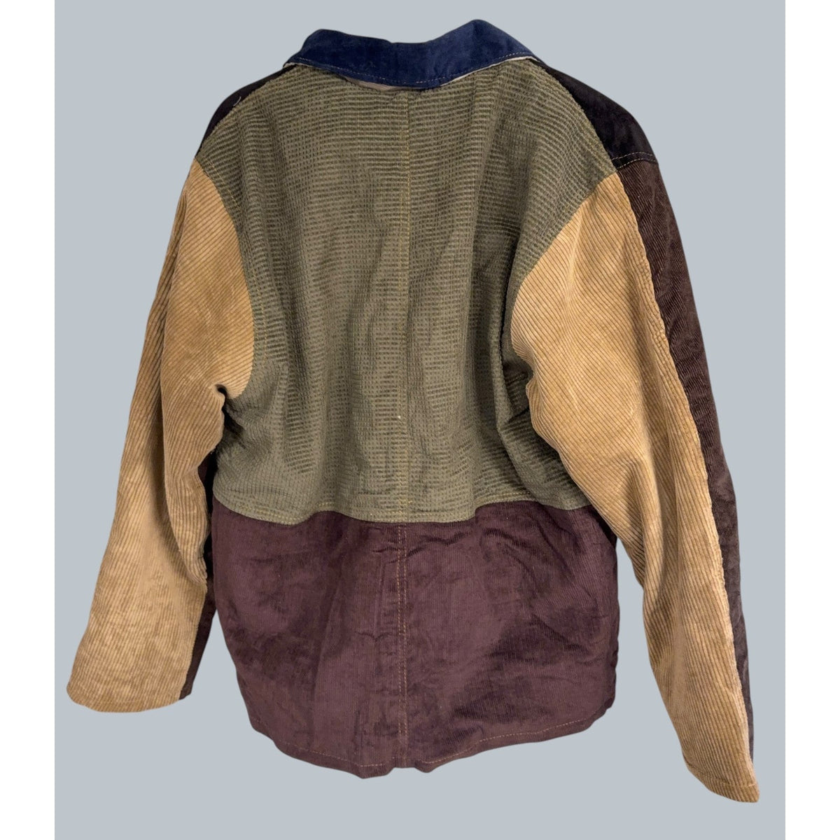 Back view of a Second Half Supply Co, LLC reworked patchwork jacket featuring olive waffle and brown corduroy panels.