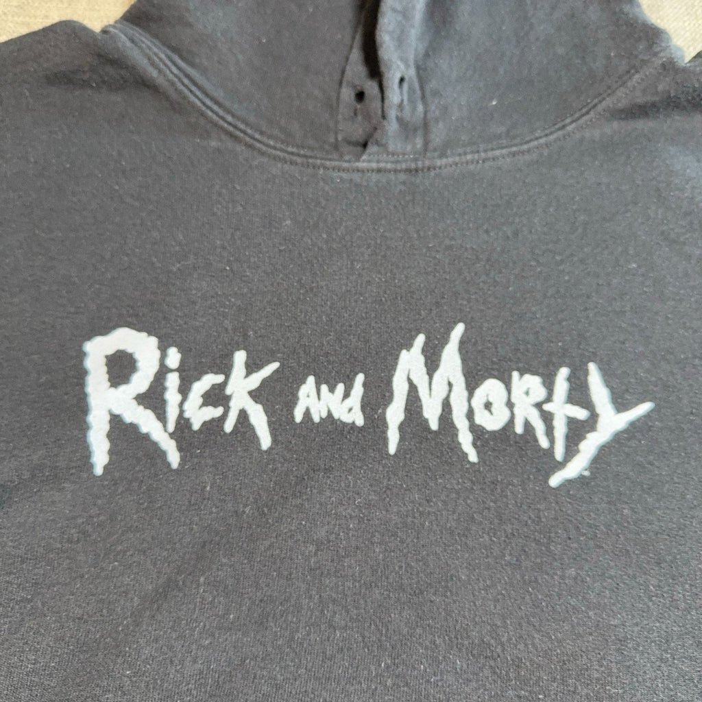 Second Half Supply Co, LLC black Rick and Morty pullover hoodie with white logo graphic on the chest
