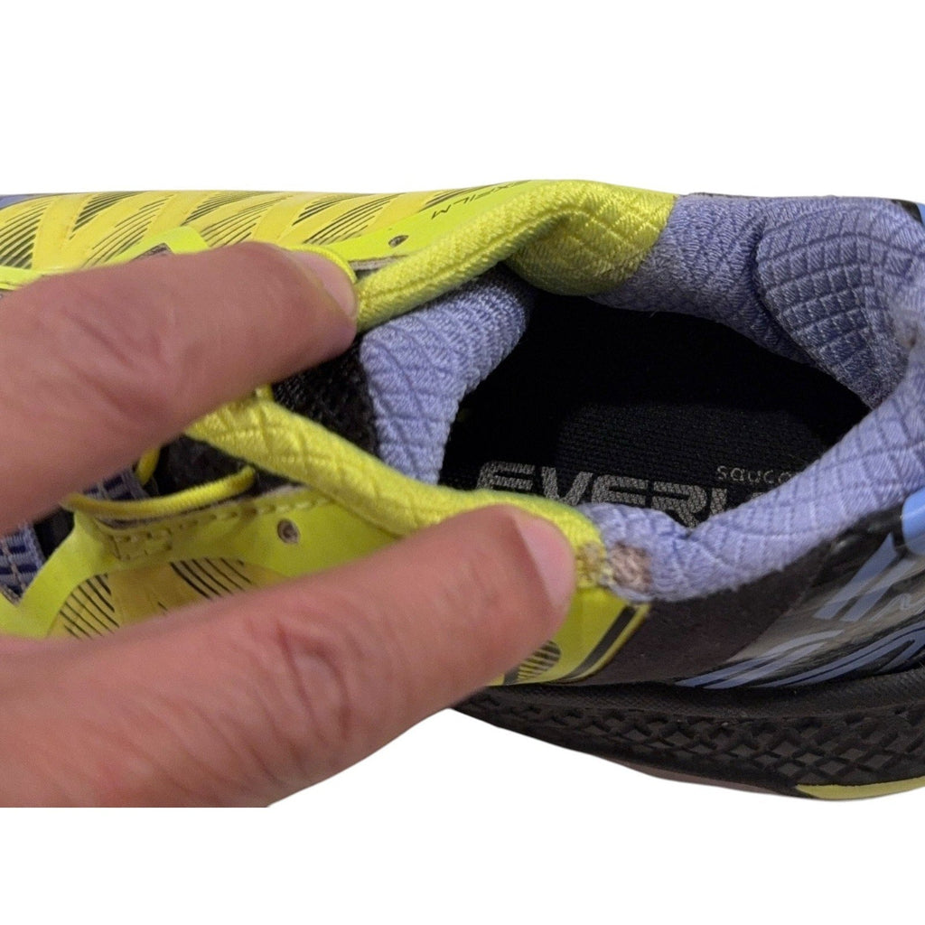Second Half Supply Co, LLC Saucony Koa ST trail shoe showing collar fraying and wear on the yellow and purple upper