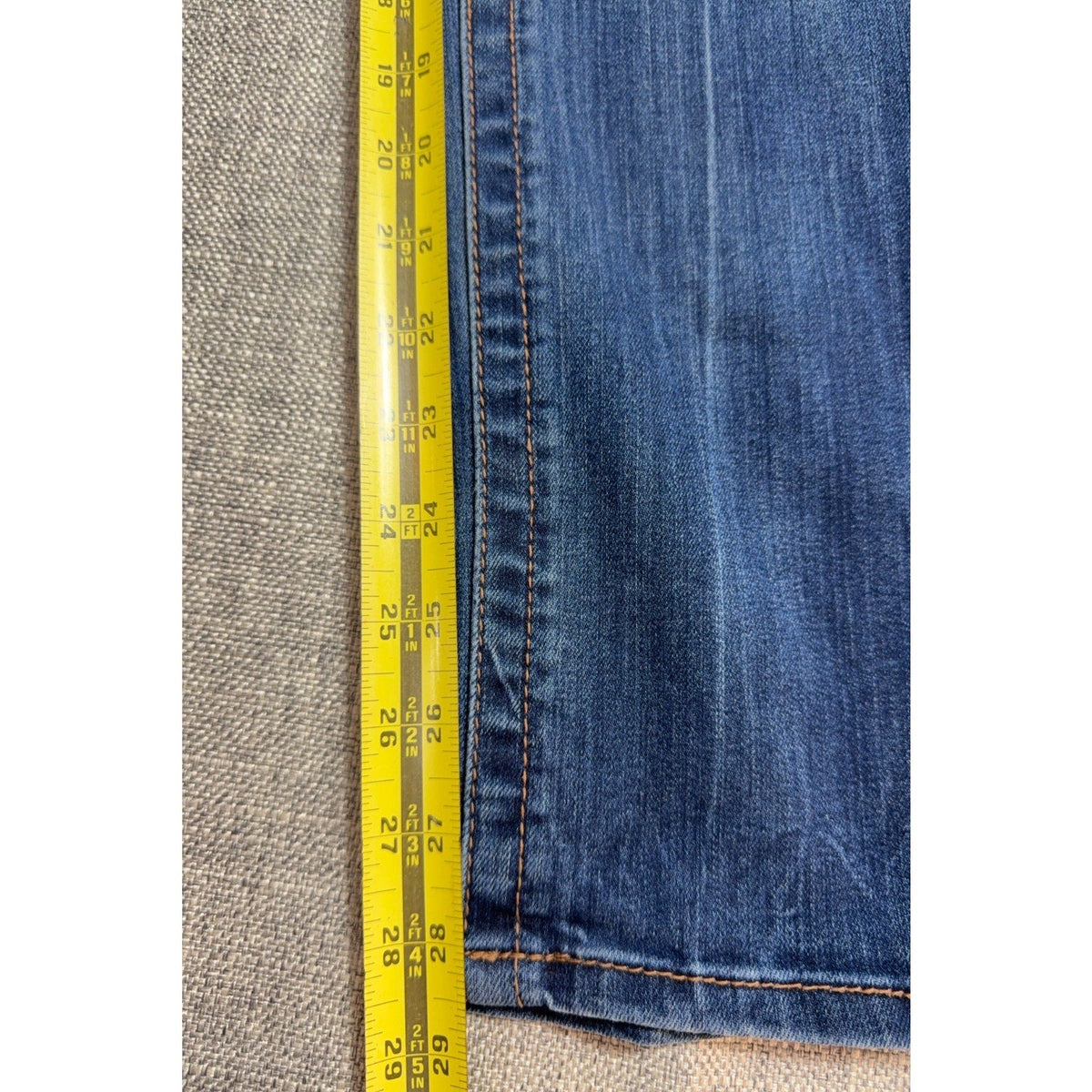 Second Half Supply Co, LLC Seven7 high-rise skinny jeans in medium blue stretch denim with a tonal side stripe detail