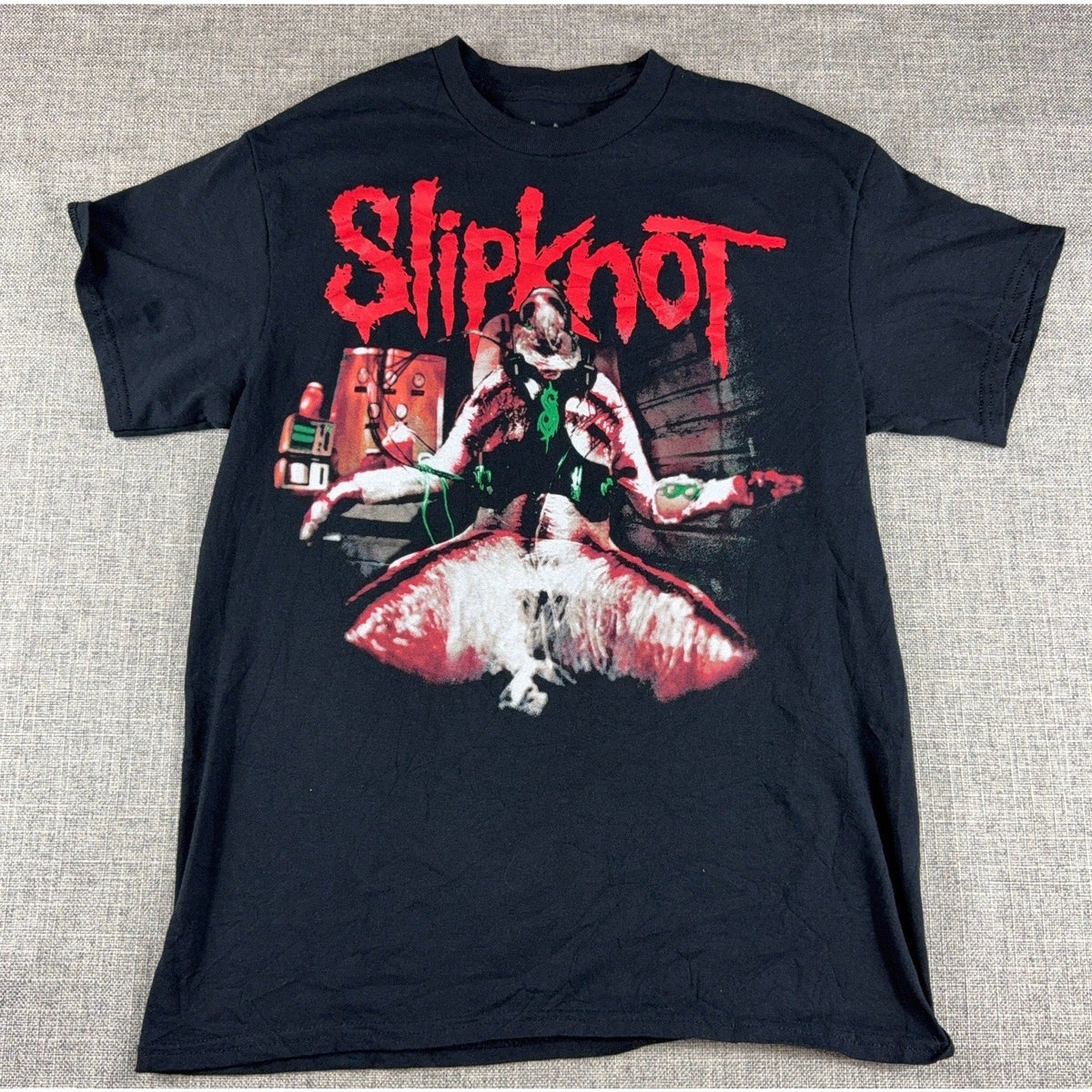 Second Half Supply Co, LLC black Slipknot band T-shirt with red and white horror graphic on the front