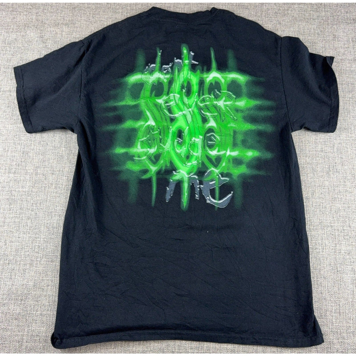 Second Half Supply Co, LLC black Slipknot band T-shirt with bold green graphic print on the back
