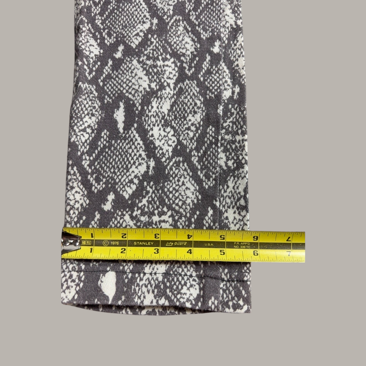 Second Half Supply Co, LLC gray and white snakeskin print cropped pants leg detail with measuring tape