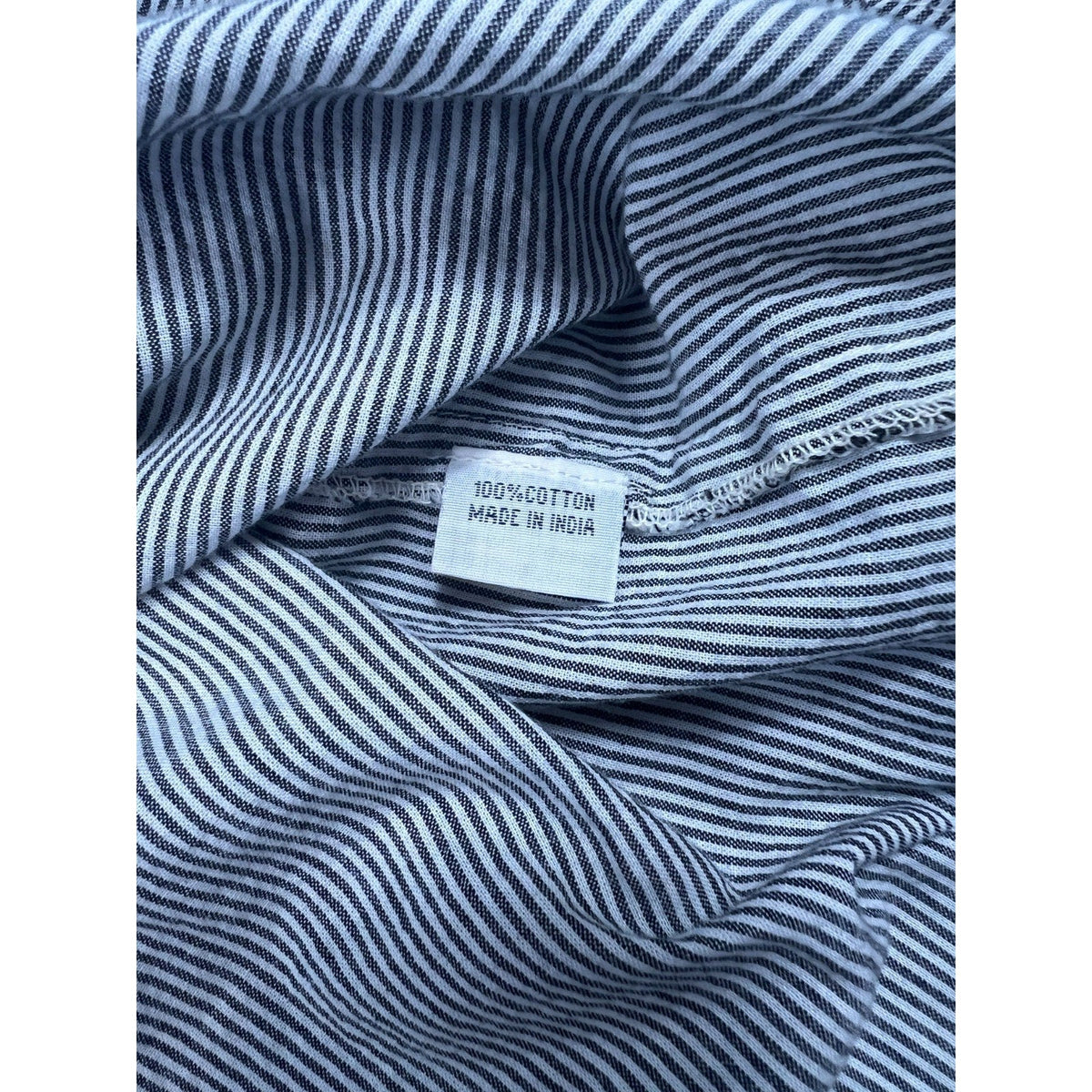Second Half Supply Co, LLC black and white micro-striped cotton fabric tag showing 100 percent cotton made in India