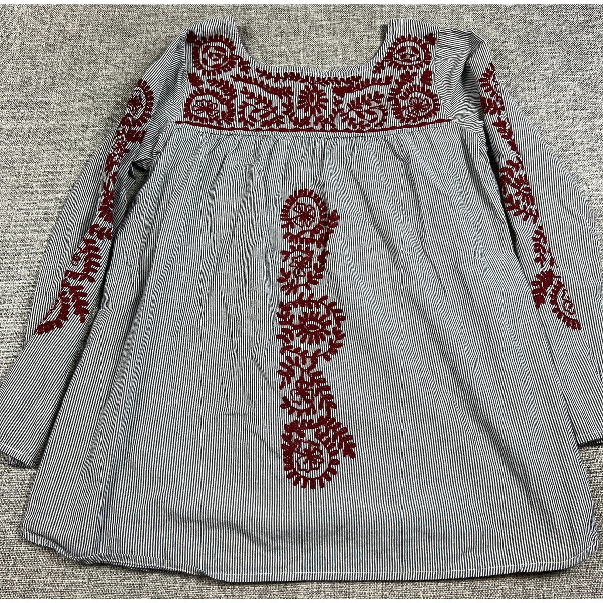 Second Half Supply Co, LLC black and white striped cotton peasant tunic with burgundy folk-style floral embroidery.