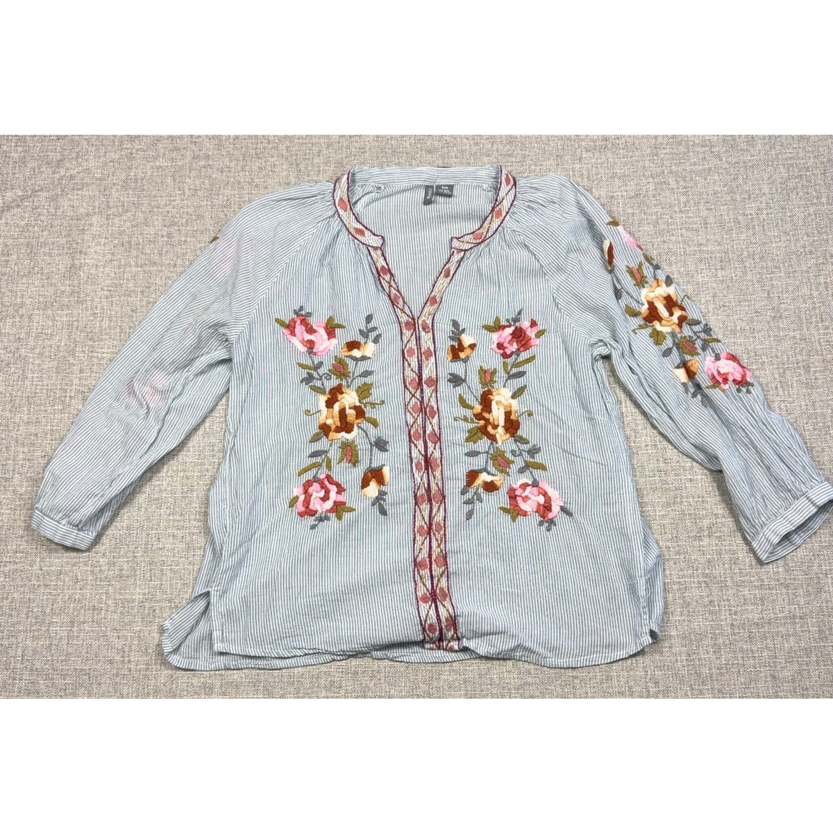 Second Half Supply Co, LLC boho cotton blouse with blue-gray stripes, floral embroidery, and a split neckline.