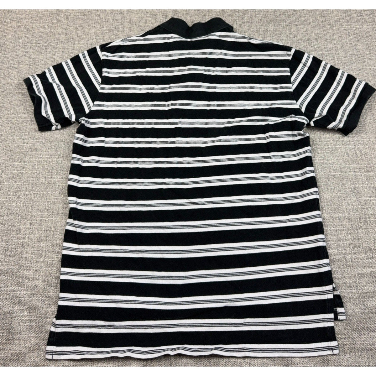 Back view of a Second Half Supply Co, LLC Polo Ralph Lauren black and white striped cotton polo shirt