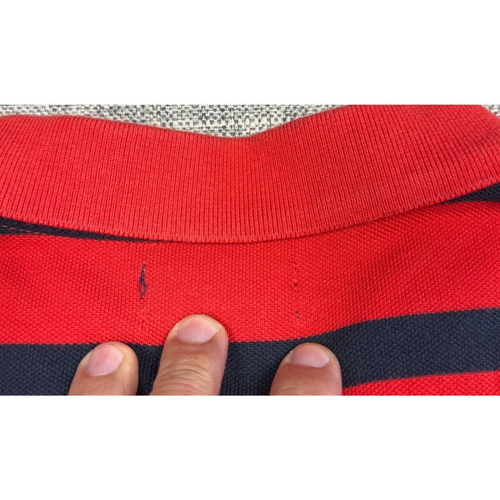 Second Half Supply Co, LLC red and navy striped cotton polo shirt showing a small snag detail below the back collar