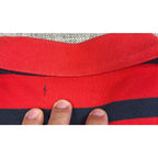 Second Half Supply Co, LLC red and navy striped cotton polo shirt showing a small snag detail below the back collar
