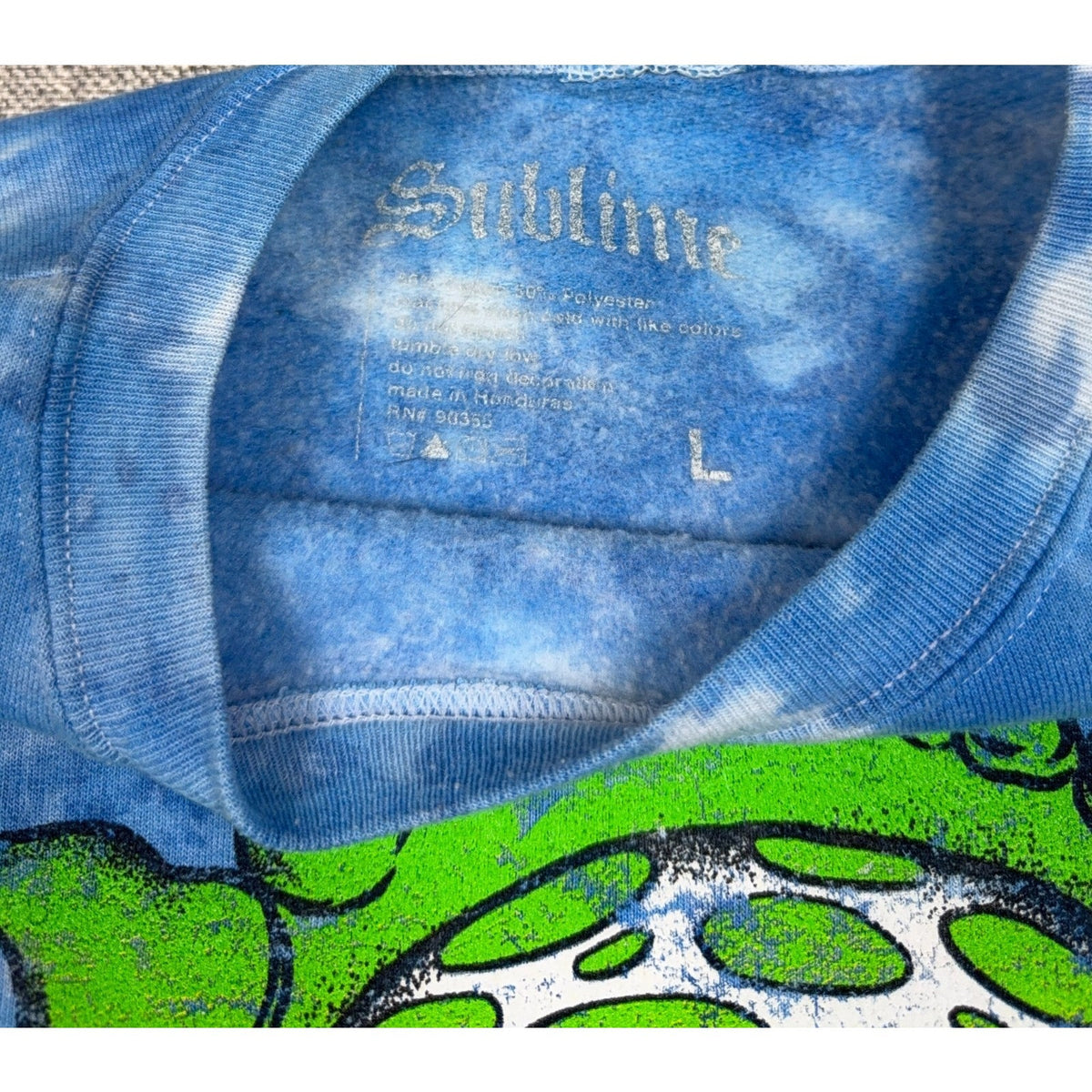 Second Half Supply Co, LLC blue tie dye Sublime crewneck sweatshirt interior label and collar detail