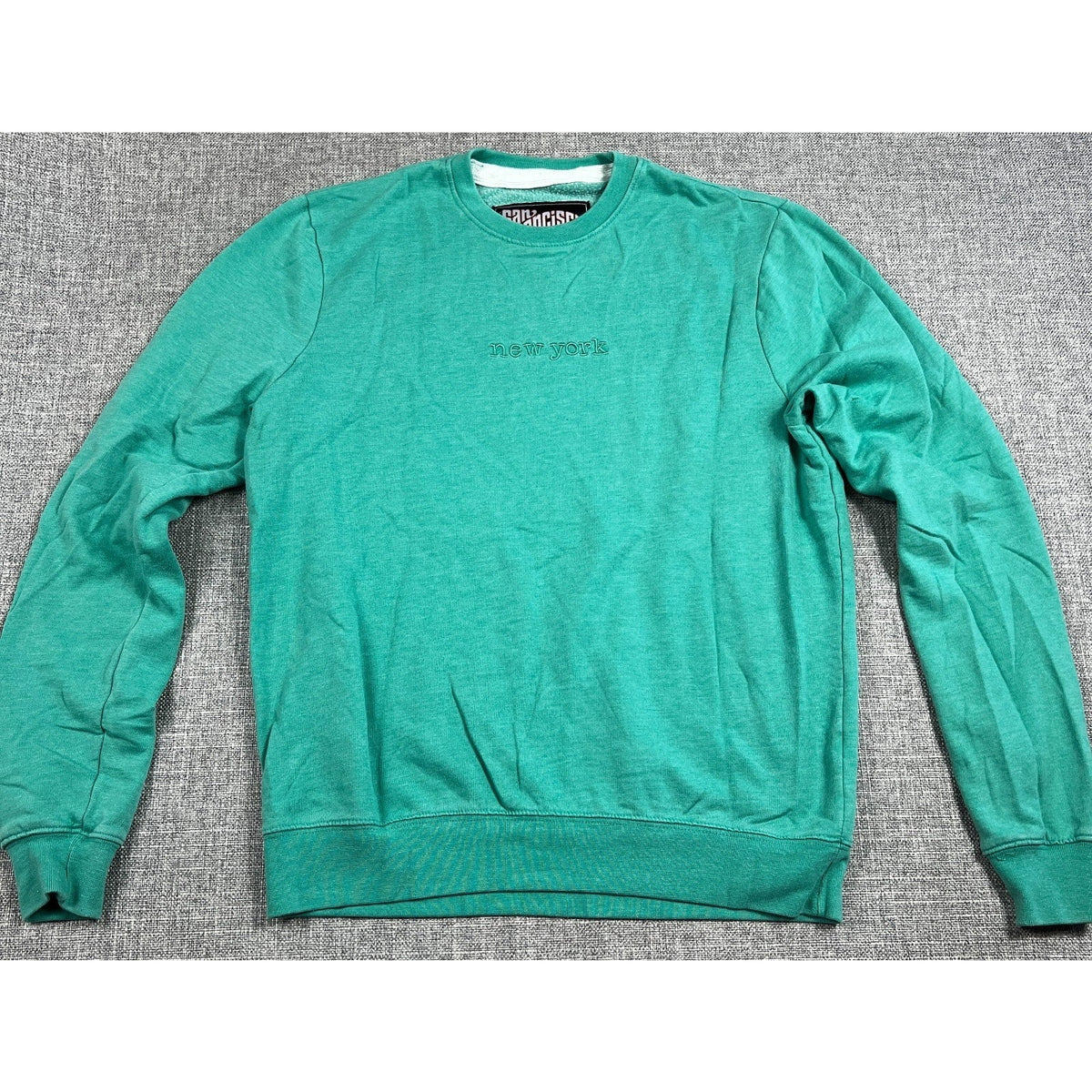 Second Half Supply Co, LLC washed teal green crewneck sweatshirt with tonal New York embroidery on the chest.