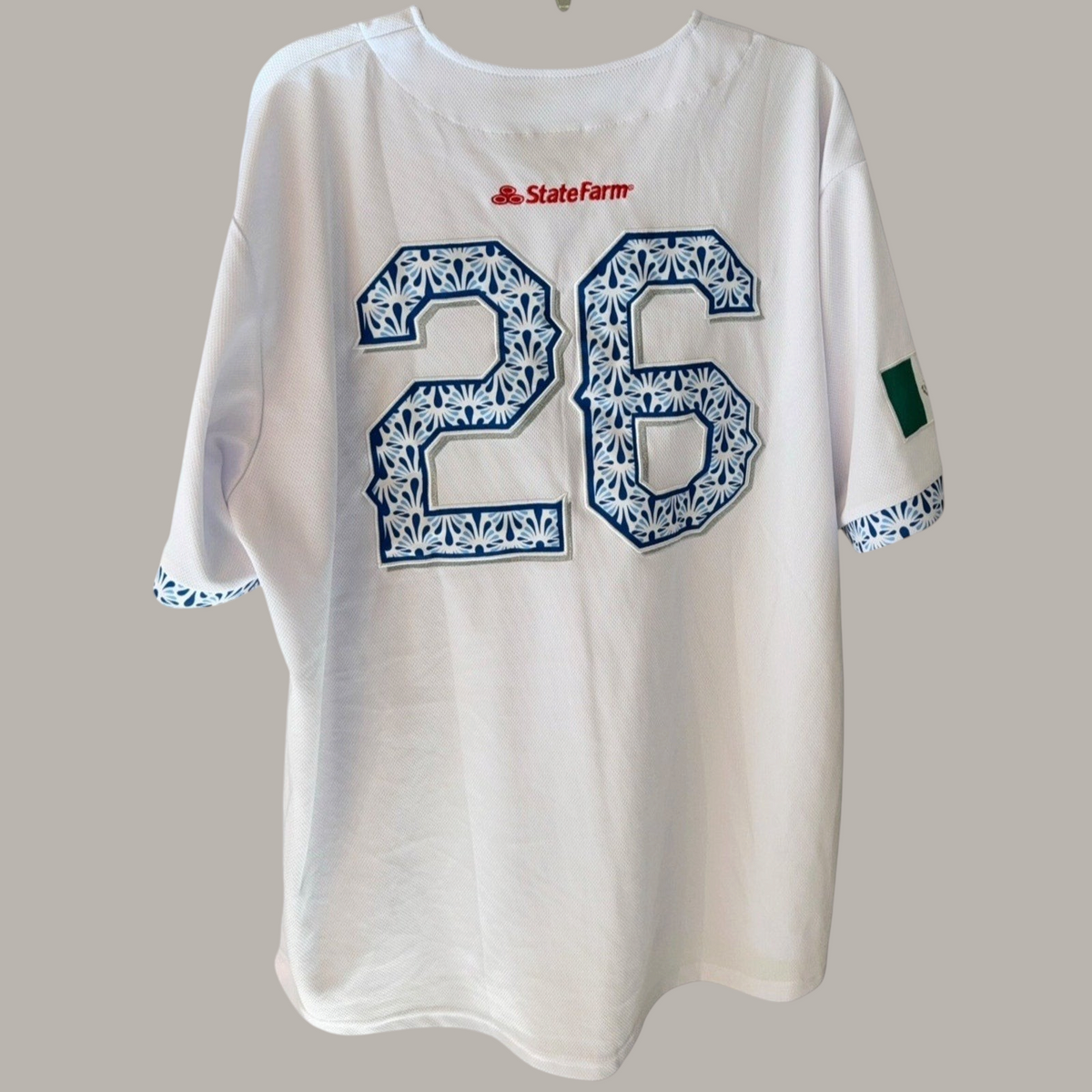 Back view of Second Half Supply Co, LLC white Texas Rangers Los Rangers baseball jersey with blue Talavera number 26