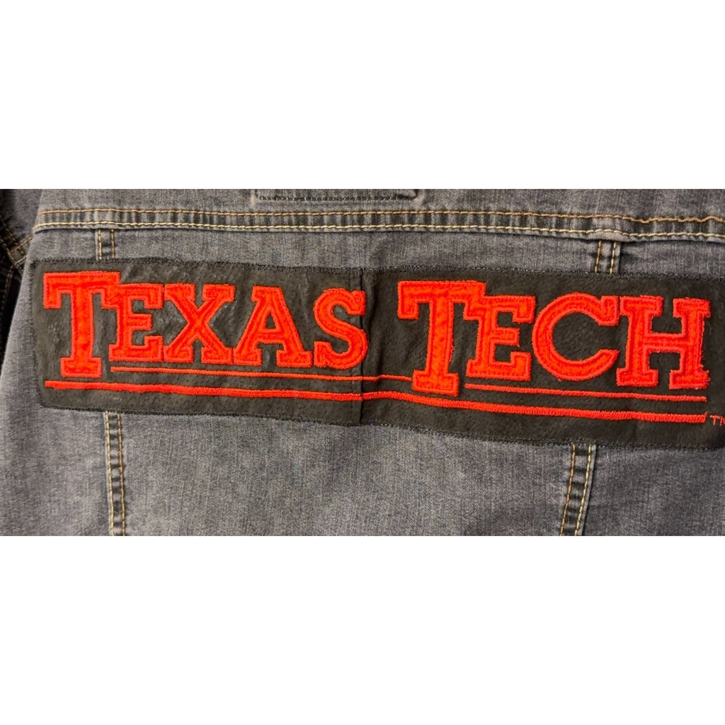 Second Half Supply Co, LLC denim jacket back view featuring a large red Texas Tech embroidered patch on black fabric
