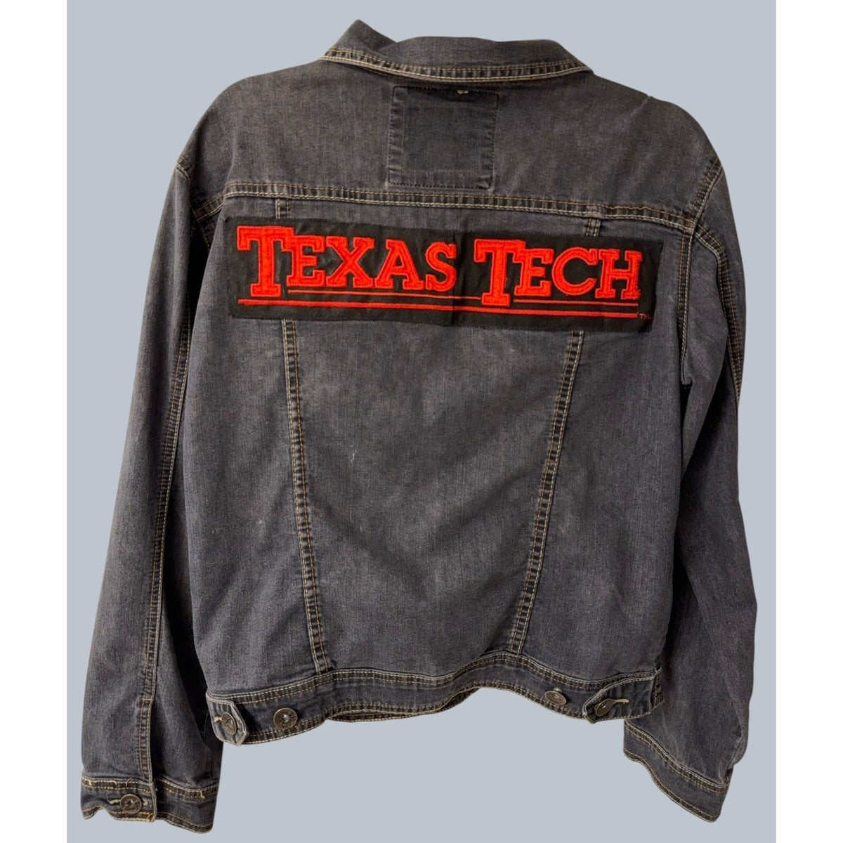 Second Half Supply Co, LLC vintage black denim jacket with large red Texas Tech spellout embroidery on the back