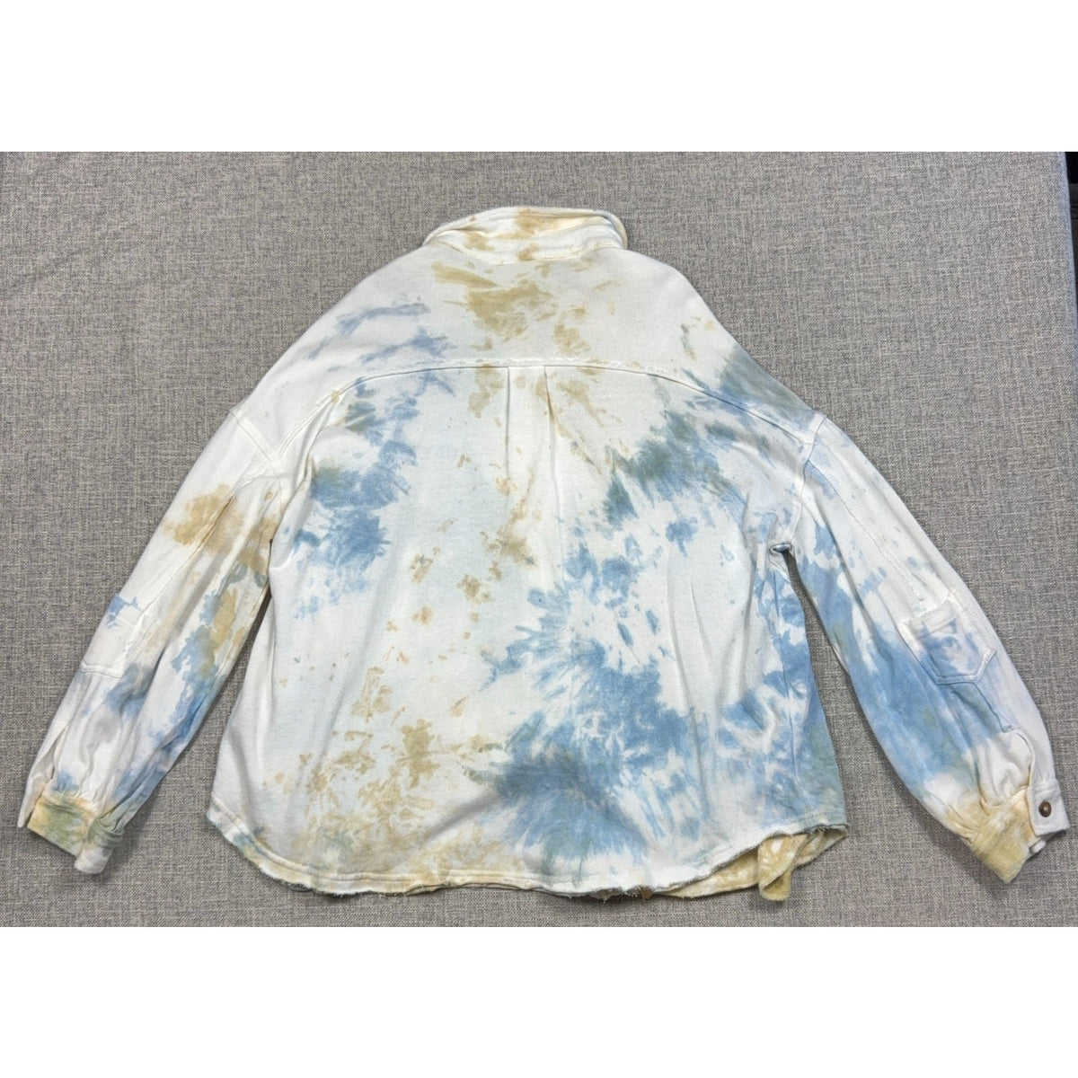 Back view of a Second Half Supply Co, LLC POL cotton shacket featuring a blue, sage, and white watercolor tie-dye.