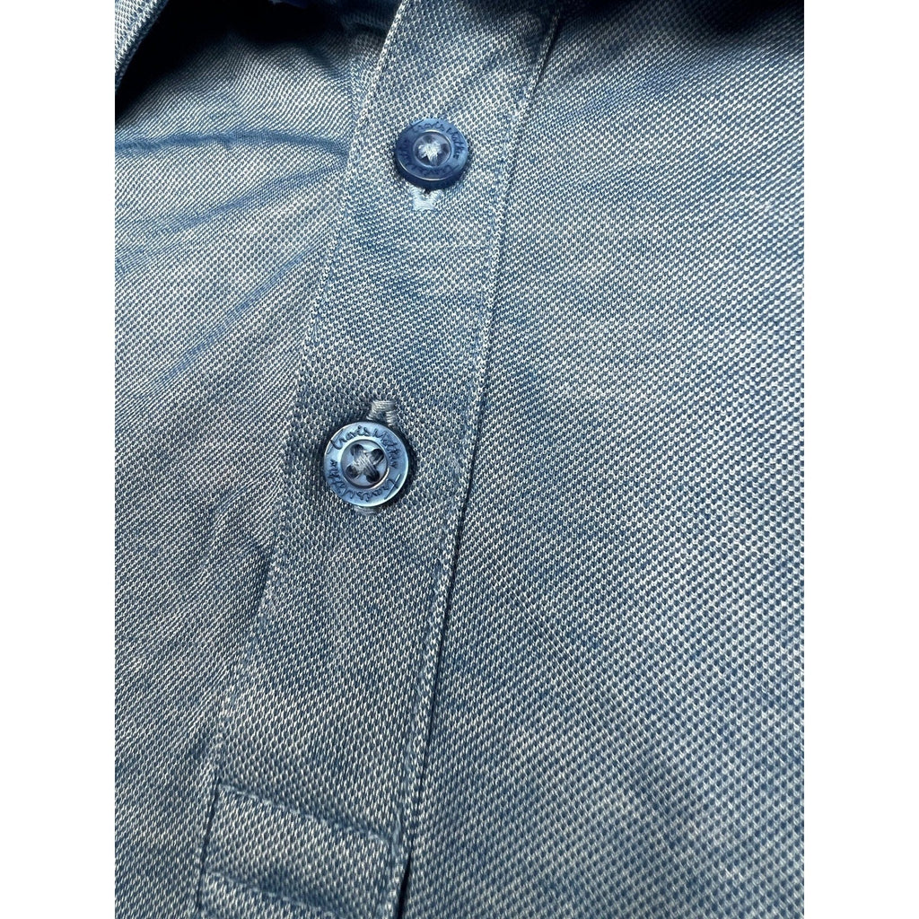 Second Half Supply Co, LLC heathered blue TravisMathew polo shirt with branded buttons and textured fabric detail