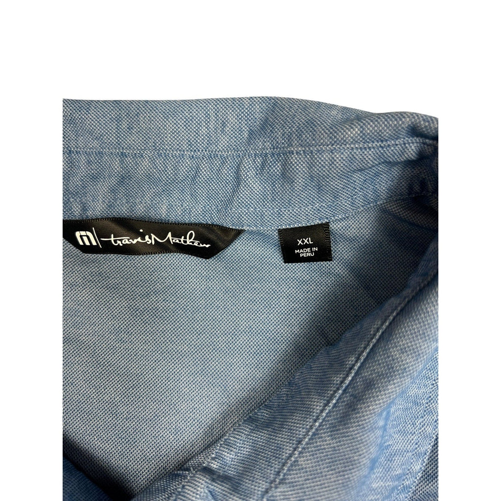 Second Half Supply Co, LLC TravisMathew heathered blue polo shirt collar with XXL size tag and brand label