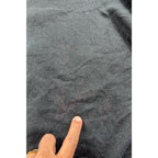 Second Half Supply Co, LLC Umbro hoodie showing a dark stain on the lower back fabric