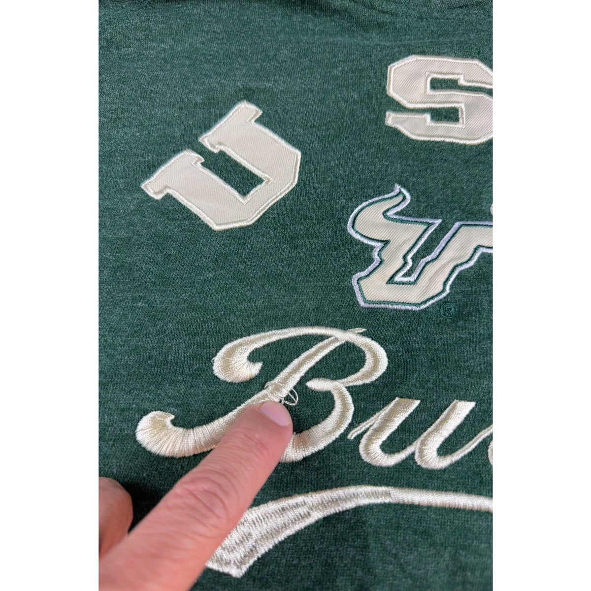 Second Half Supply Co, LLC green USF Bulls hoodie with cream embroidered lettering and a small loose thread detail