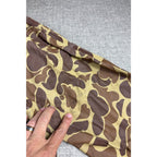 Second Half Supply Co, LLC vintage duck camo rain suit fabric with brown and tan pattern and rubberized texture