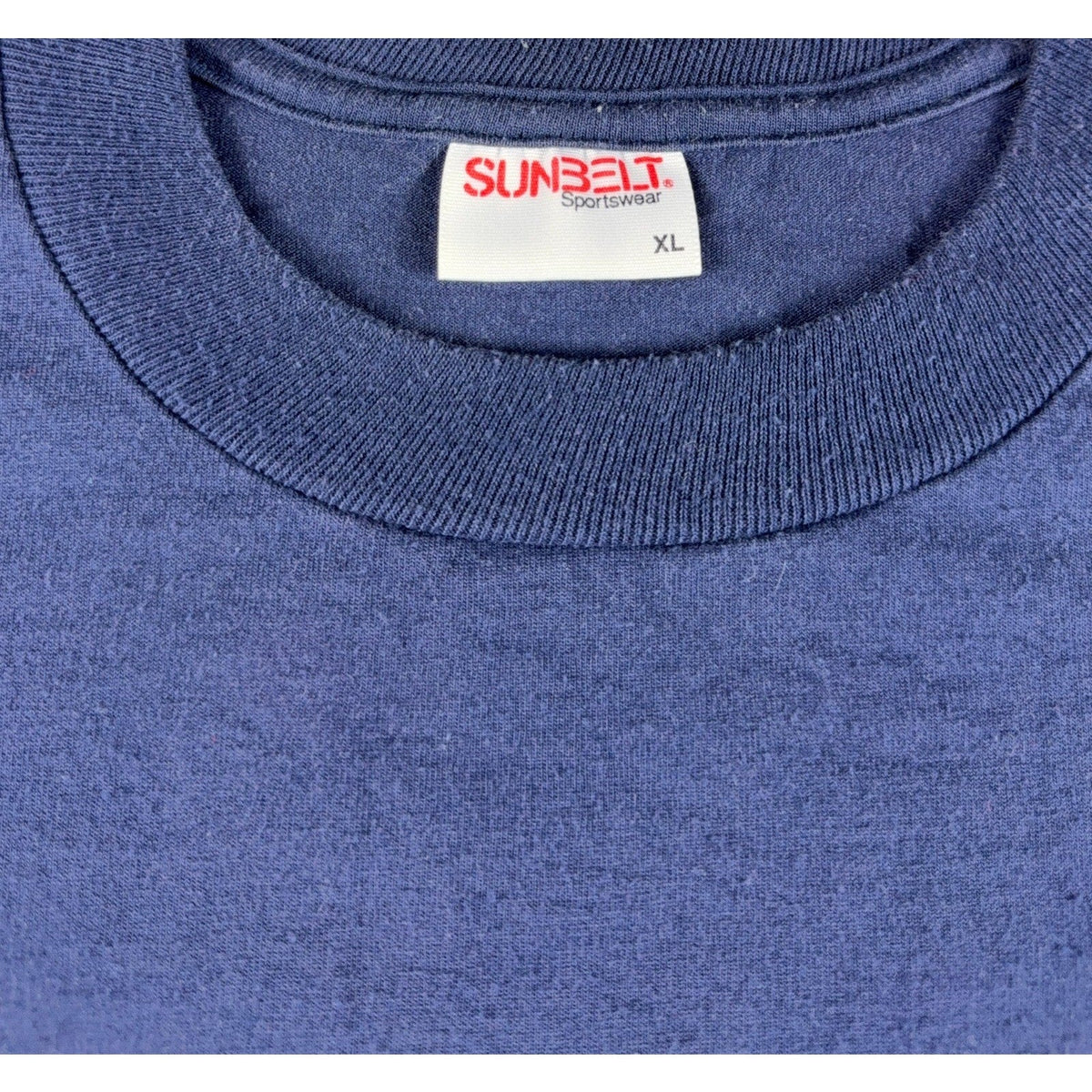 Second Half Supply Co, LLC vintage 90s navy blue Sunbelt Sportswear t-shirt tag showing size XL