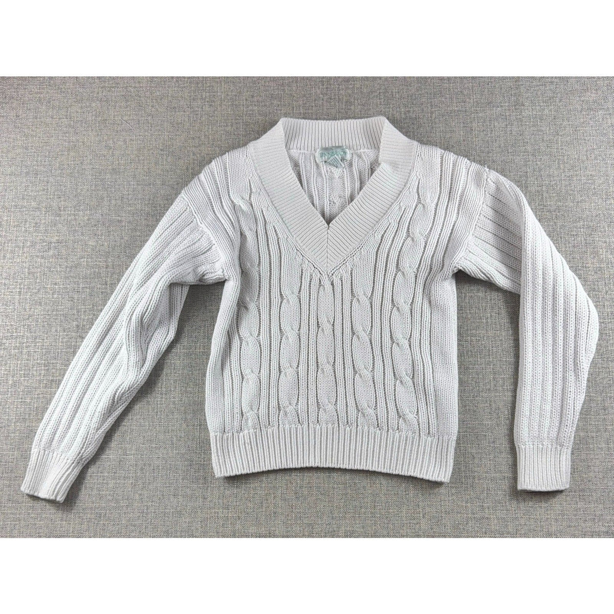 Second Half Supply Co, LLC vintage white cotton cable knit V-neck sweater with ribbed cuffs and hem.