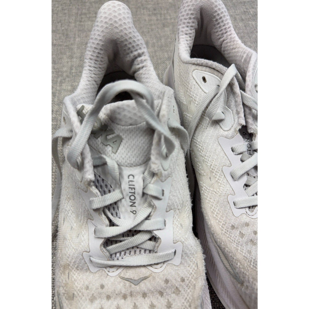 Second Half Supply Co, LLC pre-owned white HOKA Clifton 9 women's running shoes with knit uppers and lace-up closure