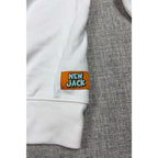 Second Half Supply Co, LLC white New Jack sweatshirt featuring an orange hem patch with turquoise logo lettering
