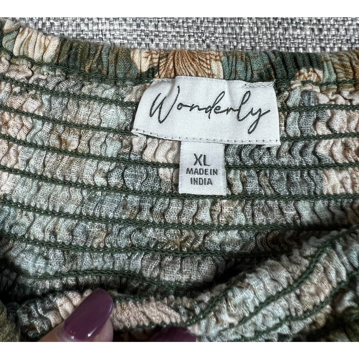 Second Half Supply Co, LLC Wonderly floral dress label showing size XL and India origin on smocked green fabric