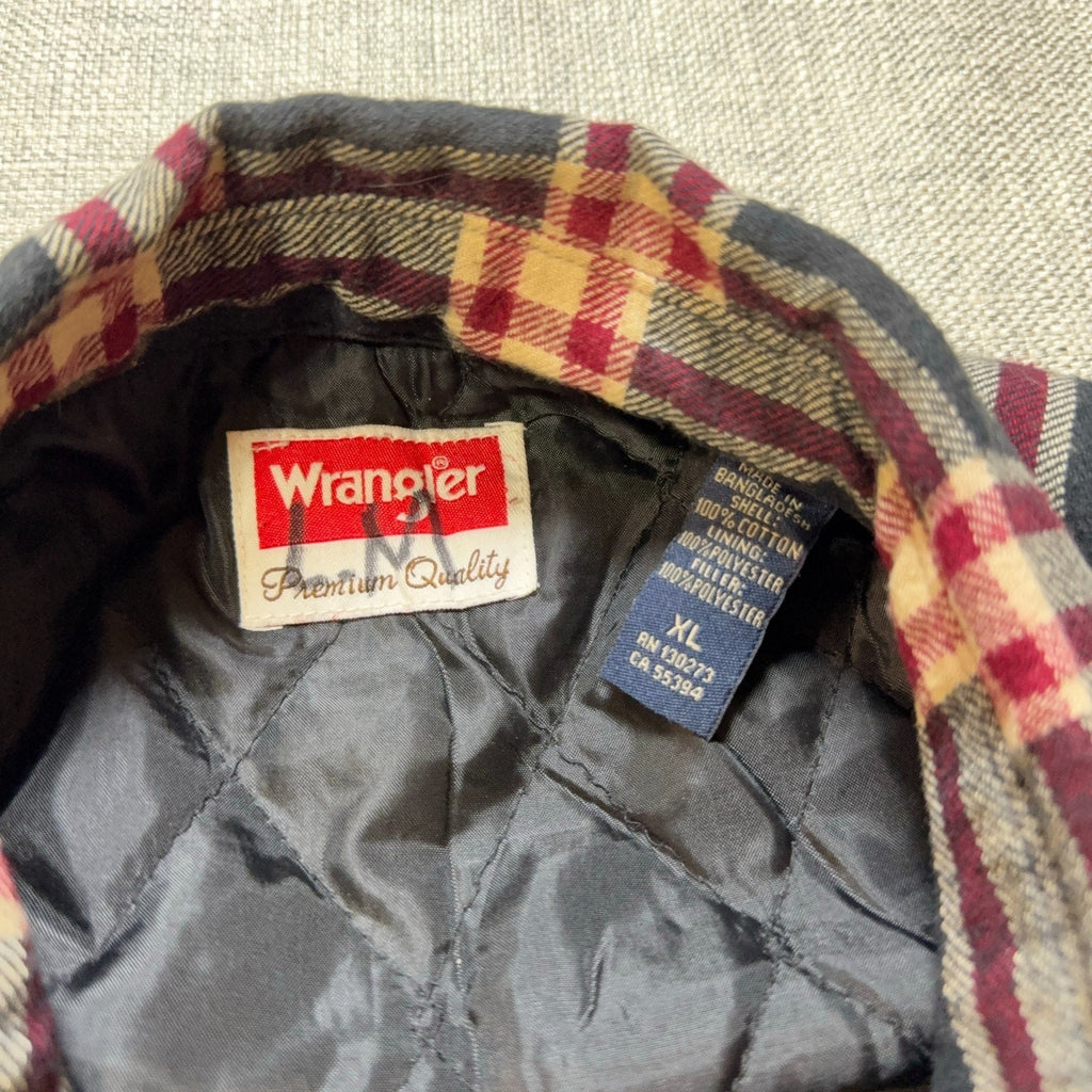 Second Half Supply Co, LLC Wrangler flannel shirt jacket interior label showing quilted lining and size XL tag
