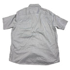 Back view of a gray Wrangler short sleeve button-up shirt with a curved hem from Second Half Supply Co, LLC.
