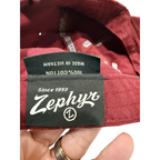 Second Half Supply Co, LLC Zephyr Florida State Seminoles hat interior tag showing 100 percent cotton material