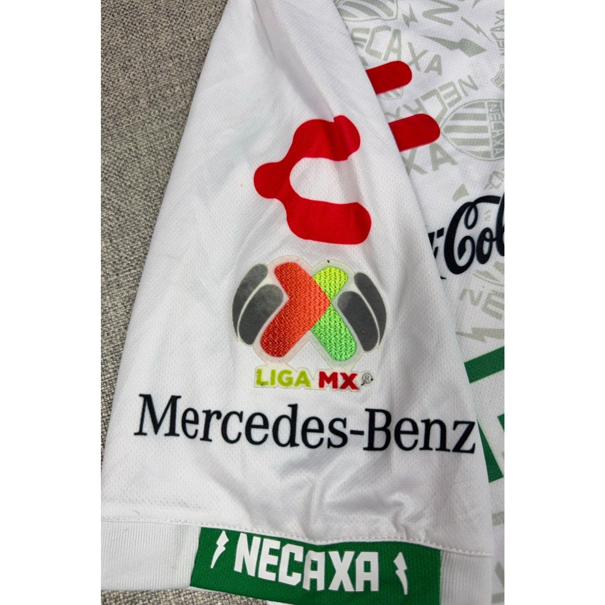 Second Half Supply Co, LLC Charly Necaxa 2019/20 home jersey sleeve with Liga MX patch and Mercedes-Benz sponsor logo